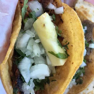 el pastor with onions and cilantros (with a pineapple slice!)