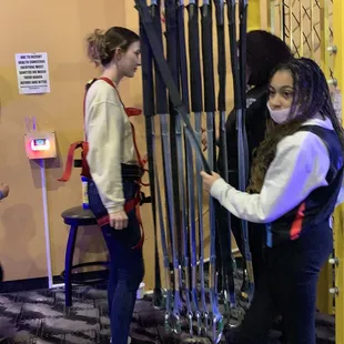 Getting harnessed for ropes course