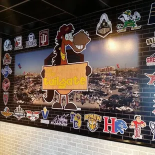 a brick wall with stickers on it