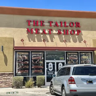 a car parked in front of the store