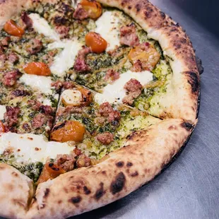 Caprese pizza with housemade hot Italian sausage