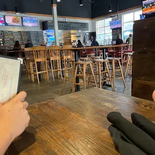 a person sitting at a table in a restaurant