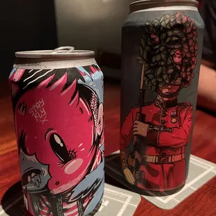 two cans of beer on a table