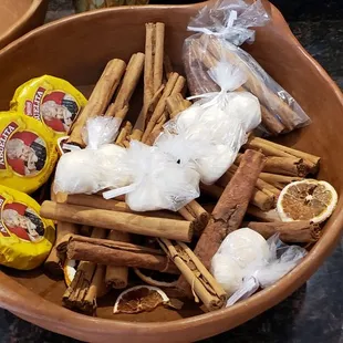 a bowl of cinnamons and other spices