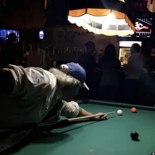 a man playing pool