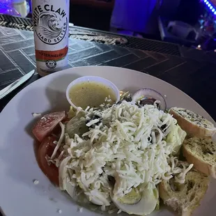 a plate of food and a can of beer