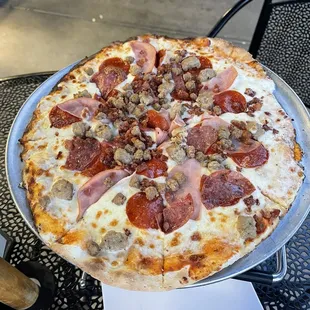 Meat pizza with garlic sauce