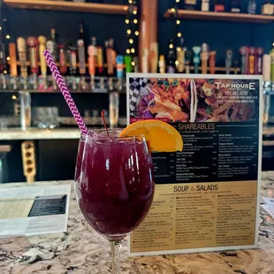 a glass of wine and a menu