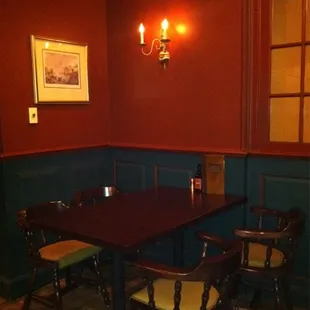 a wooden table and chairs