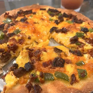 Breakfast pizza with hot honey drizzle
