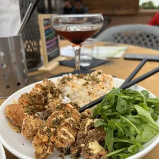 a plate of food and a glass of wine