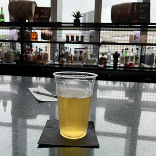 a glass of beer on the bar