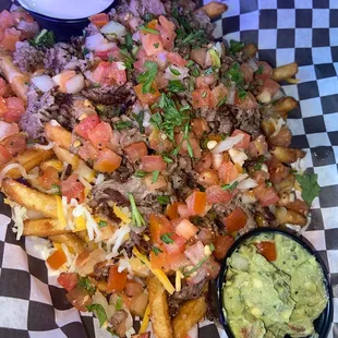 Asada fries are fire (we asked for guac and sour cream on the side)