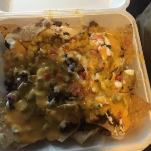 Loaded steak nachos with extra cheese and steak