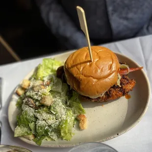 a plate with a sandwich and salad