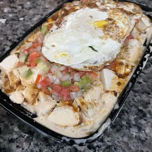 Large white rice bowl with Jerked Korean BBQ sauce, chicken, fried egg and pick de Gallo. This thing weighed like 5lbs