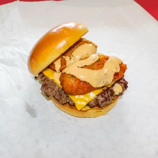 a cheeseburger on a roll