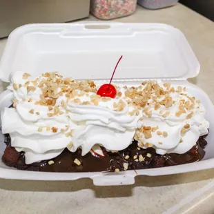 a banana split in a container