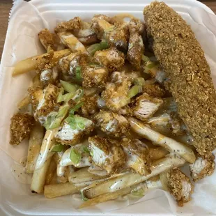 Ranch fries, with a drizzle of spicy ranch and one fried pickle spear