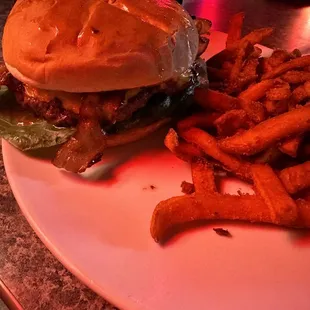 a hamburger and fries on a plate