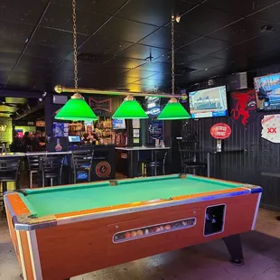 a pool table in a bar