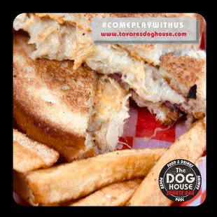 a grilled sandwich and fries