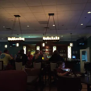 people sitting at the bar