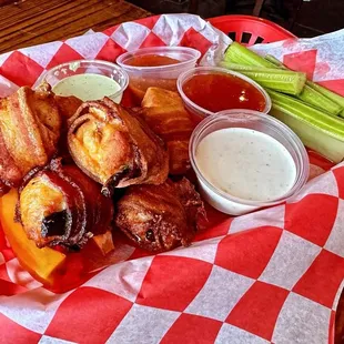 a basket of bacon wrapped in bacon and vegetables
