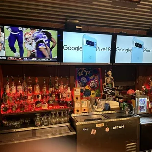 a bar with several television screens
