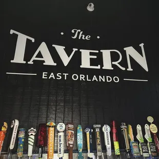 a row of beer taps