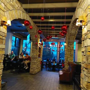 people sitting at tables in the restaurant