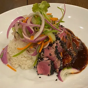 a plate of meat and rice