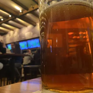 a glass of beer on a table