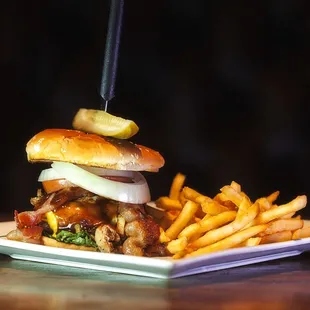 1/2 pound fresh formed Cheeseburger with avocado, pulled pork and bacon and all the staples.