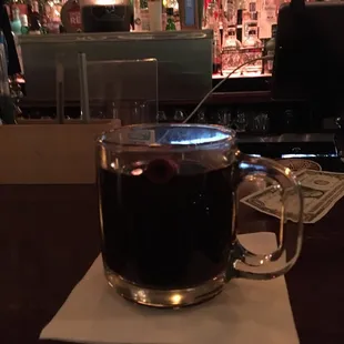 a cup of coffee on a napkin