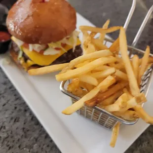 a burger and fries on a plate