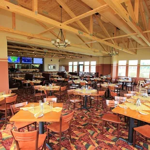 tables and chairs and a television