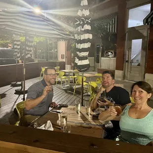 a group of people sitting at a table