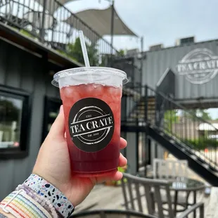 a person holding a cup of tea