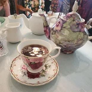 a cup of tea and a teapot