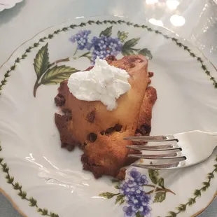 a piece of cake on a plate with a fork