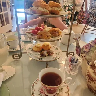 a table full of tea and pastries