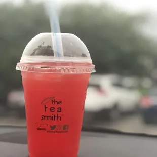 Strawberry tea with strawberry popping boba.