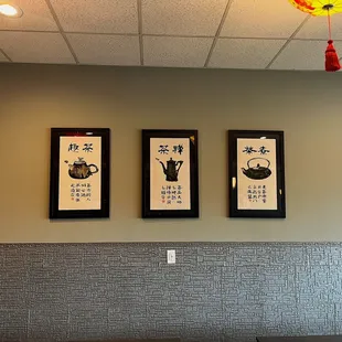 three framed teapots on the wall