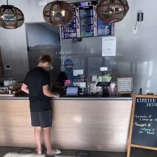 a man standing at the counter