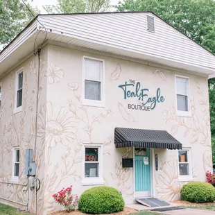 Storefront. Gorgeous mural makes the building unforgettable and beautiful.