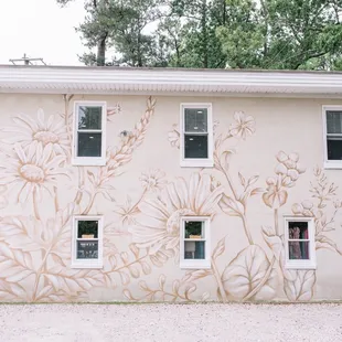 Side of the building with gravel lot.
