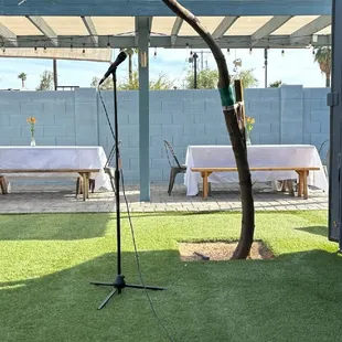 Tables under the ramada and the microphone.