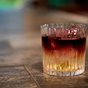 a shot of a drink on a table