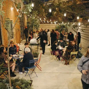 a group of people sitting at tables